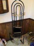 Black & gold metal corner shelf and matching trach can.