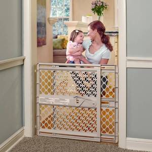 lot 230069 image: Toddleroo by North States Supergate Ergo Child Gate, Baby Gate for Stairs and Doorways. Includes Wall Cups. Pressure or Hardware Mount. Made in USA. (26 Tall, Sand)