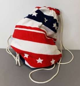 lot 42 image: Patriotic Plush Beach Towel with Integrated Drawstring Bag.