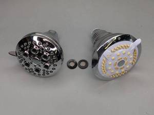 lot 66 image: 2 Clean Shower Heads. One is Delta Brand