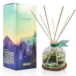 lot 1143 image: LOVSPA Winter Forest Pine Reed Diffuser Gift Set  Juniper Berries, Sandalwood & Cedar Notes  Made with Real Botanicals  Wooden Coaster  Proudly Made in The USA