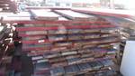 Pallet of treated 2x10 old bleacher seats.