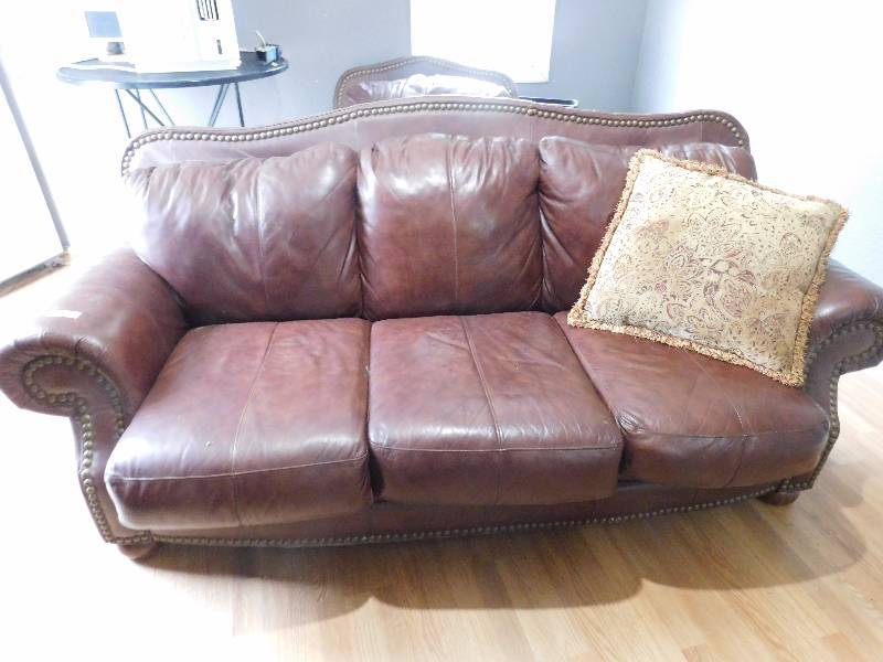 lot 37 image: Leather Couch with Accent Pillow