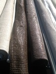 Four rolls of shade material as pictured