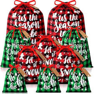 lot 4987 image: Bulk Pack Christmas Drawstring Bags