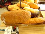 (15) ct. lot artificial bread; baguettes, rolls in a metal basket