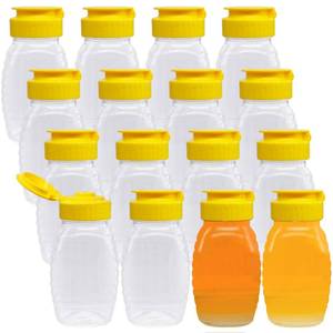 lot 60473 image: 16 Pcs 3.7oz Clear Plastic Honey Jar,Squeeze Honey Bottle Container with Flip-Top Lid,Empty Honey Bottle for Storing and Dispensing