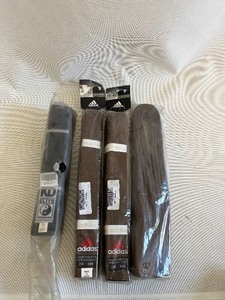lot 136 image: LOT of 3 BROWN & 1 BLACK ADIDAS KARATE & MARTIAL ARTS COMBAT LVL BELTS ALL NEW