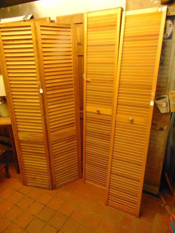 lot 8038 image: (2) pair of door shutters (1) pair hinged 73-34 x 16 (32 over all) , (1) pair with knobs in the center 78-14 T x 14-34 wide (each)