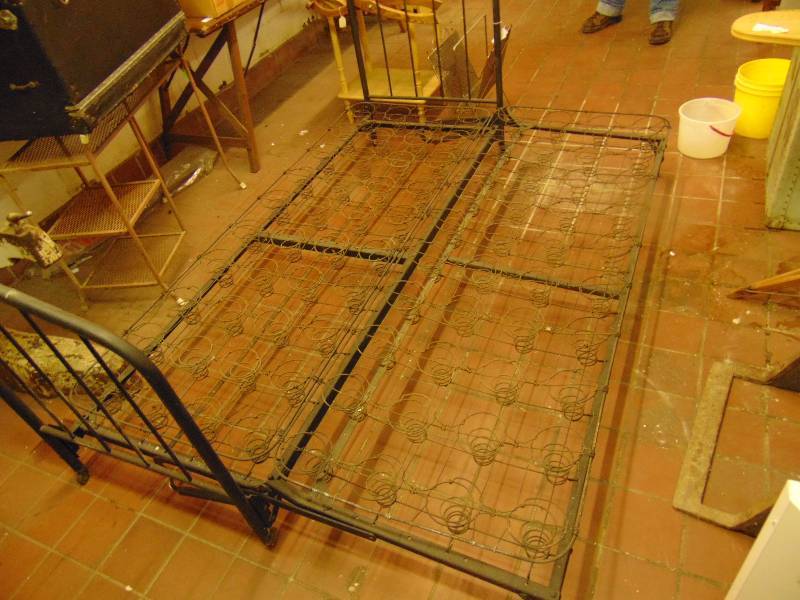 lot 8111 image: Antique Iron Bed 76 L x 52 W (pulled out to full width) x 33 at tallest point