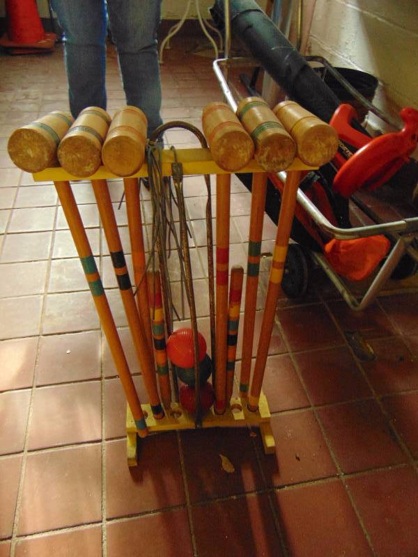lot 8151 image: Vintage croquet set, (6) mallets, (4) balls, wood and metal stakes, and stand