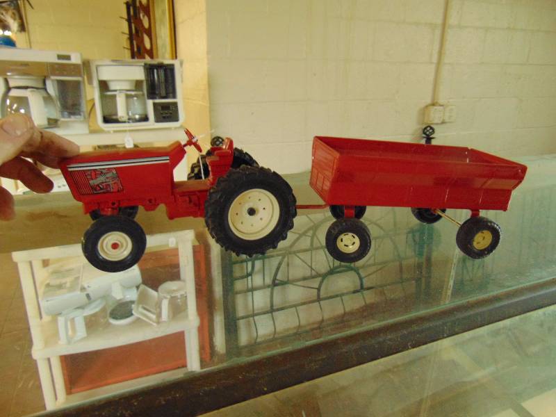 lot 8156 image: Vintage Red metal tractor with cart 3429H