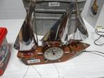 Wooden sailboat clock w/metal sails.