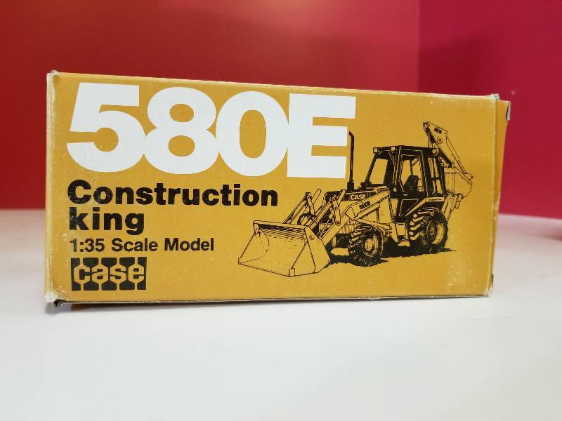 lot 5054 image: Case 580E Construction King  Backhoe Loader, 135 scale, Mod # 2933, German Made, NIB