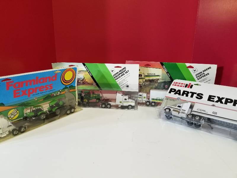 lot 5103 image: Ertl 4 each Semi, 164 scale, JD Hauling w2 TJD Parts ExpressCase IH SemiDeutz-Allis Hauling w2T, (Number 553055354832238) NIB