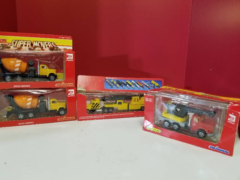 lot 5145 image: Majorete 4 items, 2 cement trucks 1 enterprise semi1 wench truck HO Scale, New but box opened