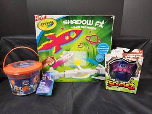 lot 254 image: NIB Crayola Shadow FX Color Projector, New Create Your Own Soap Kit, and NIB Scritterz Toy