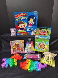 lot 257 image: New Magic Tooth Fairy Game, New Barbie Toy, New Poppets, and More