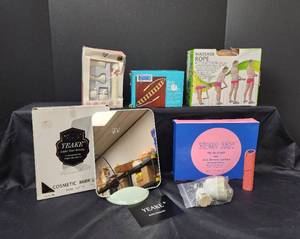 lot 270 image: NIB Neon Jam Eco Shower Curtain, NIB Body Rolling Massager, NIB Cosmetic Mirror, NIB Facial Care Kit, and NIB Massage Rope