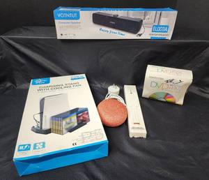 lot 274 image: NIB Computer Speaker, NIB Charging Stand with Cooling Fan for P5 Digital EditionUltra HD, Echo Dot with Cord, New DVD-RW, and NIB Wristband Hand Sanitizer Dispenser