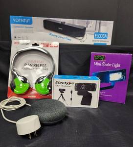lot 275 image: NIB Computer Speaker, NIB Strobe Light, NIB 1080P HD Webcam, New Universal IR Wireless Foldable Headphones, and Echo Dot with Cord