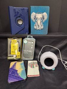 lot 276 image: New Phone Cases (Galaxy S4 and IPhone 4 & 4S), New Tablet Cases, Little Hippo Alarm Clock, and More