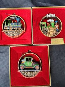 lot 341 image: Vintage Hallmark Ornaments - 1976 Train (with box), 1977 Train (with box), and 1977 Classic Car (with box)