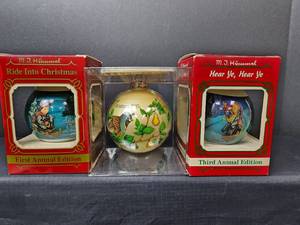 lot 346 image: MJ Hummel Vintage Ornaments with Boxes - 1983 Ride into Christmas 1st Edition, 1985 Hear Ye, Hear Ye 3rd Edition, and 1981 Our ___ Christmas Together