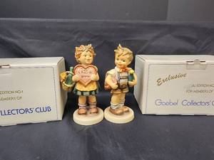 lot 355 image: Goebel Figurines - Girl with Valentine and Basket 1972 Special Edition #1 387 (with box) and Boy with Valentine and Wine 1979 Special Edition #4 399 (with box)