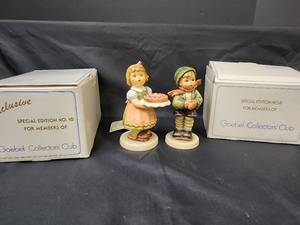 lot 356 image: Goebel Figurines - Girl with Strawberry Cake 1983 Special Edition #10 440 (with box and certificate of authentication) and Boy Dressed up for Winter (with box)