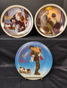 lot 377 image: Norman Rockwell Plates (original box and certificates of authenticity) - Wrapped Up in Christmas 1981 18084A, Mothers Day After the Party 1981 9535C, Mothers Day The Cooking Lesson 1982 1000J