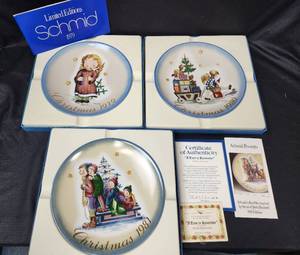 lot 378 image: Schmid Christmas Plates - Starlight Angel 1979 (original box, Signed by Berta Hummel), Parade into Toyland 1980 (original box), and A Time to Remember 1981 (original box and certificate of authenticity)
