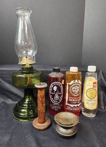 lot 438 image: Oil Lamp, Lamp Oil, and Cast-Iron Ashtray