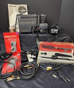 lot 548 image: Sharp VHS Camcorder VL-L65U, Camcorder Microphone, and Accessories