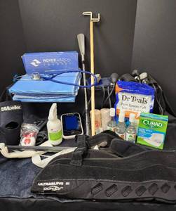 lot 579 image: (2) New Incontinent Bed Pads, Manual Blood Pressure Cuffs, Electronic Blood Pressure Monitor, SplintsSlings, and More
