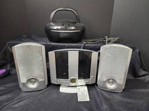 lot 593 image: (2) GPX Stereo is New and Sylvania Stereo