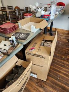 lot 44576 image: Contents Of Table, Includes Kitchen Items, Disposable Cups And More