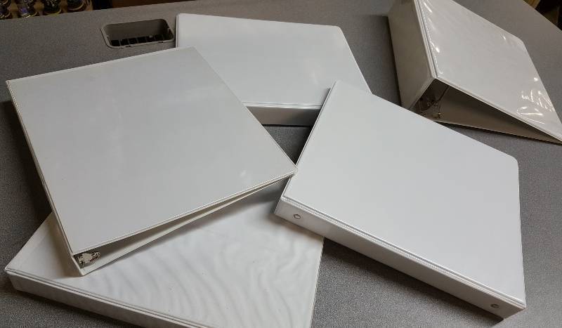 lot 6624 image: Set of 5 total 3 ring notebooks with clear pockets inside of each cover.  One is a 3 back and the others are 1-18.