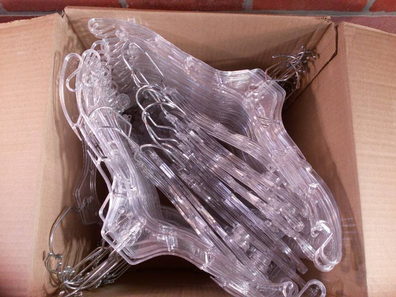 lot 99 image: Clear Plastic Hangers With Metal Hook