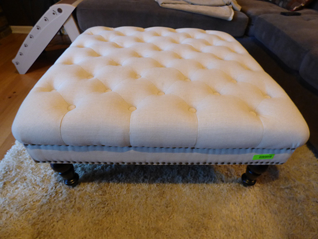 lot 1025 image: Imported Ottoman on Casters. Button tuck hand done 34 x 34 x 17 high