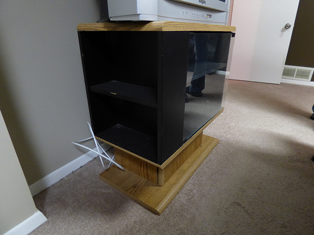 lot 1083 image: Oak Entertainment Center with Glass Door 31 W 17 D 29 H