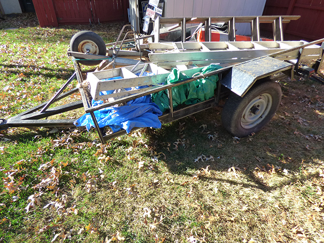 lot 1119 image: Trailer USElectrical Hookup  100long an d62wide with Drop Down Tail Gate with 4 Ladder Steel Barrel, 3 Tarps etc.