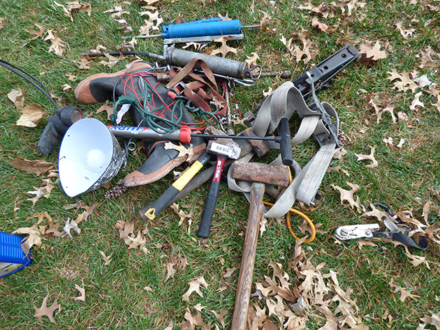 lot 1308 image: 2 Grease Guns, 4 Large Hammers, Jack with 4 Way, Bike Pump with Gauge, 2 Dog Holders, with Cable Line, Heavy Duty Tie Down Shop Lamp, etc�.