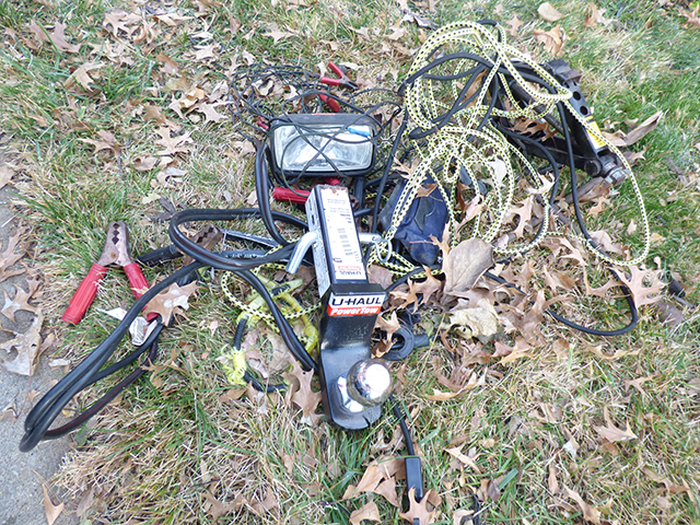 lot 1311 image: U-Haul Poser Tow 2 Bail with Extention & Pin & Scissor Jack, 4 Way Battery Light, Jumper Cables with Extension Bed Cover with Hooks