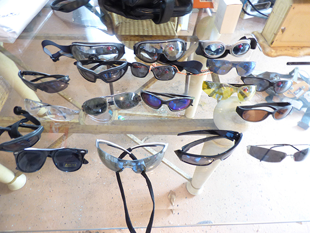 lot 1313 image: 3 Pairs of Goggles, 16 Pairs of Glasses - clearambertinted,  ie. Rayban, Harley Davidson, Oakley, etc., and U-Haul Lock with Key