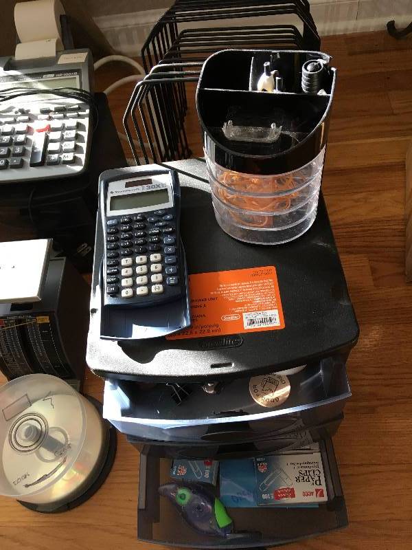 lot 1329 image: Office supplies - Electric Calculator, 2 Hand held with tape roll, 3 hole Punch, Huge power strip etc..