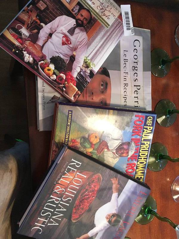 lot 1321 image: 4 Cook books Emerial Lagasse & 3 Stella Glasses 6 Mantini & 1 Wine glases.