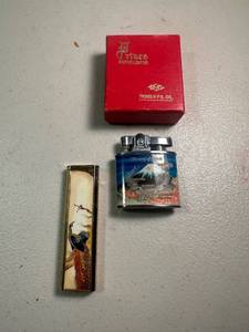 lot 138 image: Lot of 2 Refillable Enamel Lighters