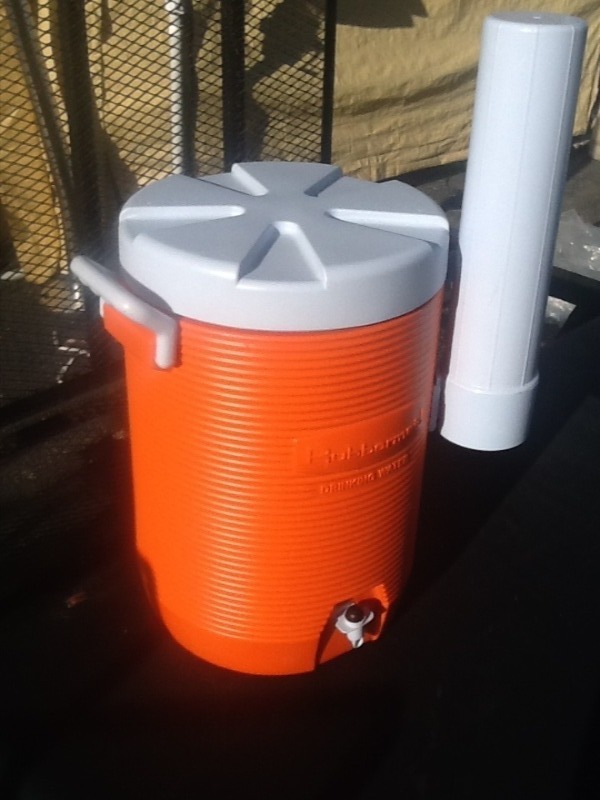 lot 11 image: Nice beverage cooler with Papercup dispenser great for construction on our door working