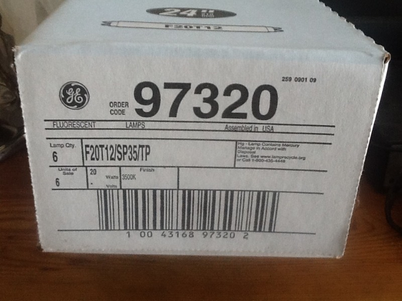 lot 71 image: Three cases of  fluorescent  lightbulbs as pictures